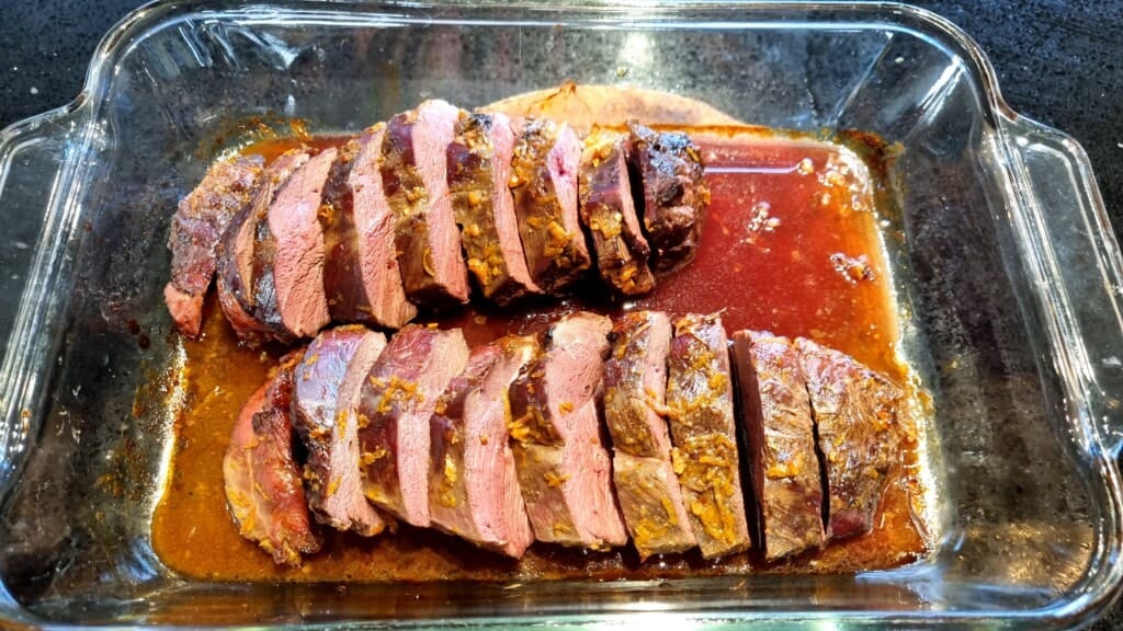 Baking dish with cut-up pieces of duck breast